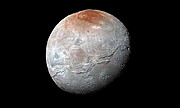 Pluto Spray Paints its Moon Red