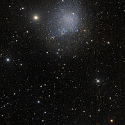 Wider view of irregular dwarf galaxy IC 1613 from the Dark Energy Survey