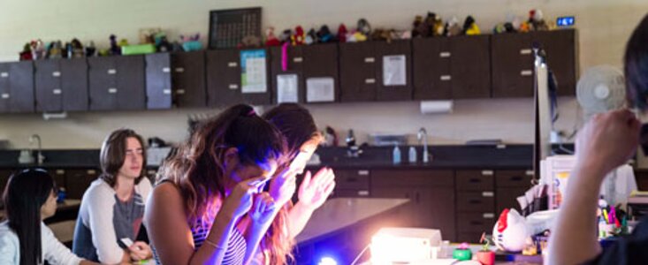 Students observing light colors during Journey