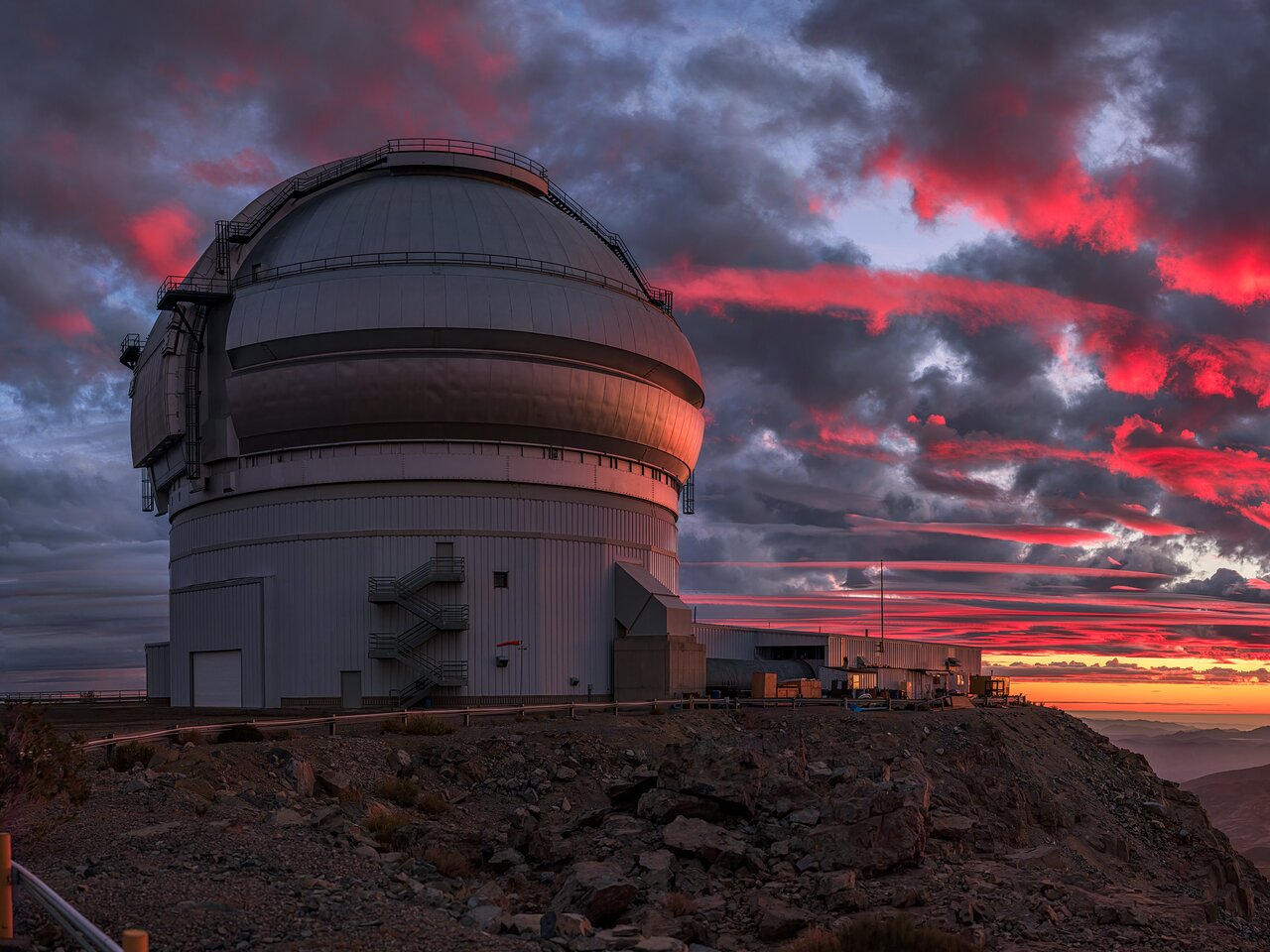 Sunlight Paints a Crimson Sky Over Gemini South