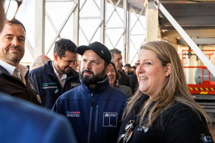 Alejandra Voigt and Stuartt Corder with President of Chile Gabriel Boric inside the Víctor M. Blanco 4-meter Telescope