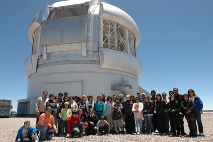 Staff family tour participants outside Gemini South