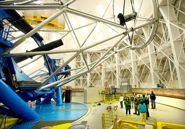 Gemini North staff family tour participants inside the dome